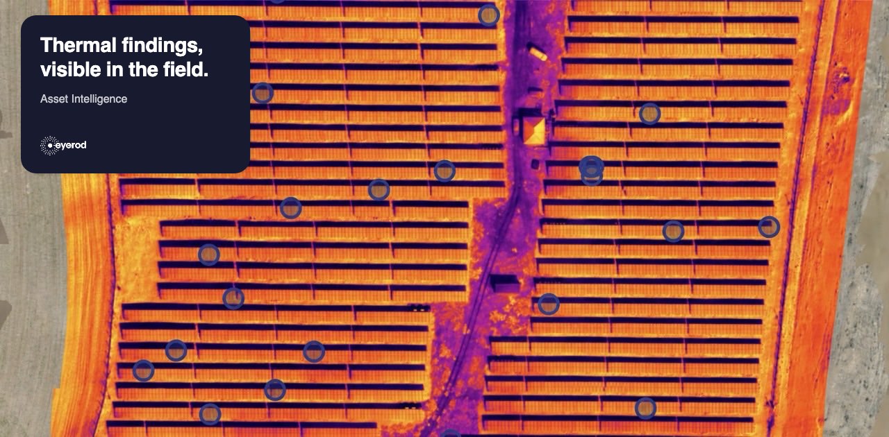 Top-down thermal orthophoto of PV module rows with detected thermal findings marked